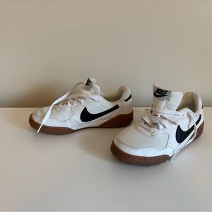 Nike Kids White Sneakers with Black Swoosh and Gum Sole
